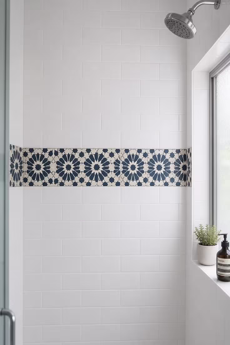 19 Cozy Apartment Bathroom Decor Ideas for Small Spaces 17 Moroccan star pattern removable vinyl decals in navy and cream applied in a band on white subway tile inside an apartment shower