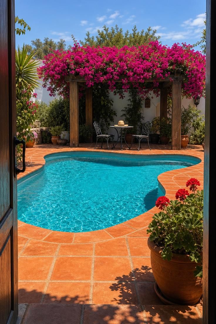 15 Backyard Pool Designs That Bring Resort Comfort Home 6 Lagoon-shaped aqua pool with bougainvillea-draped timber pergola and terracotta tile deck in bright midday sun.