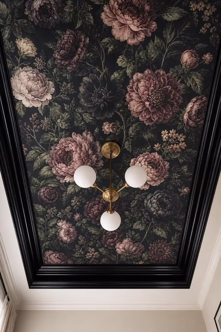 13 Moody Black Nouveau Bedroom Ideas Worth Trying Now 5 Overhead view of a bedroom tray ceiling wrapped in dark floral wallpaper with peonies in charcoal and rose tones framed by glossy black molding.