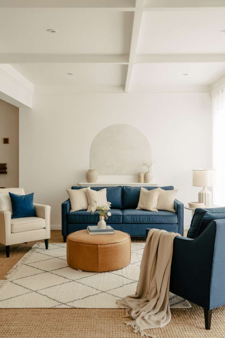 31 Fresh Blue and White Living Room Ideas That Inspire 27 Navy sofa with cream chairs and beige accents for warmth