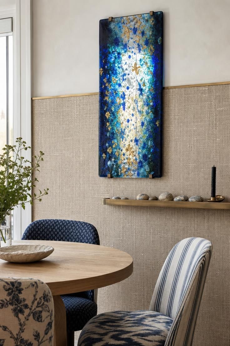14 Colorful Eclectic Home Ideas for a Joyful Space 13 Natural linen wall covering with a fused-glass panel glowing in cobalt, teal, and gold.