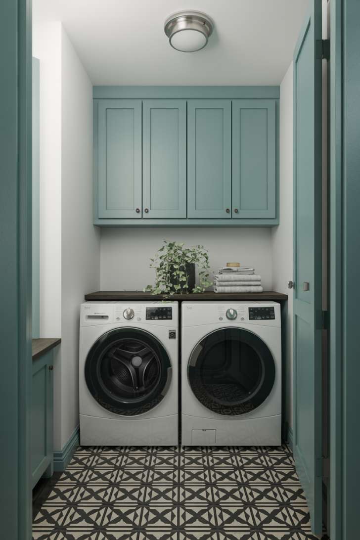 11 Dreamy Colorful Laundry Room Ideas You Need to See 2 A small laundry room with teal Shaker cabinets and bold black-and-white patterned cement tile floor