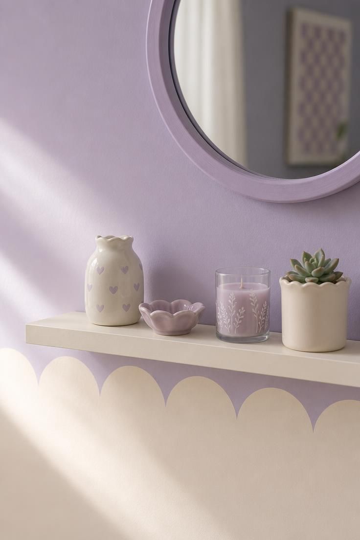 11 Cute Bedroom Ideas for Teens That Feel Super Cozy 8 Two-tone lavender and cream teen bedroom wall with a scalloped paint line and floating shelf holding small ceramics and a succulent.