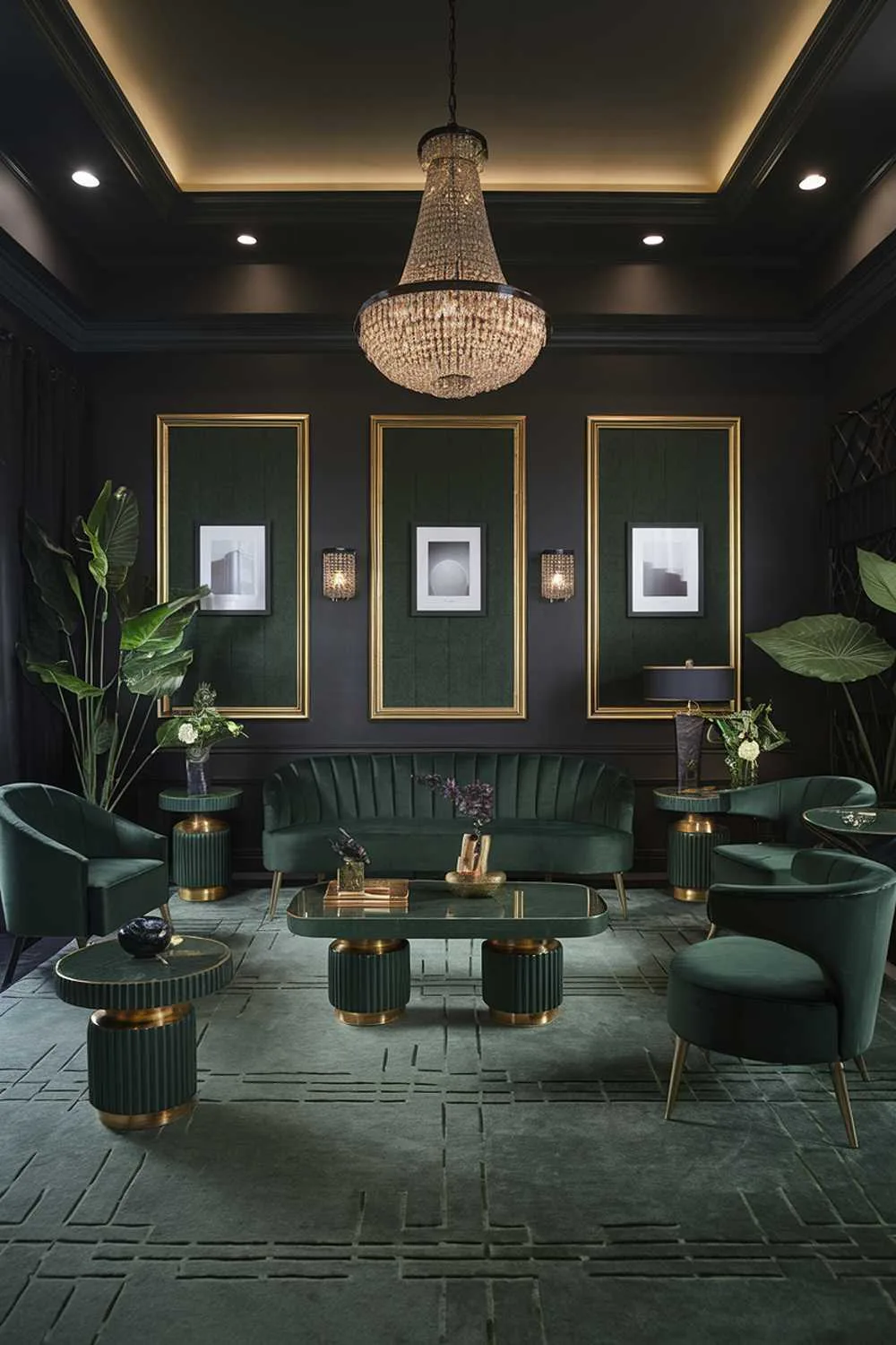 A dark green living room with stylish and elegant decor. The room has a high ceiling, with a chandelier hanging in the center. There is a green sofa with gold legs and a few chairs. A coffee table with a gold base and a green top is placed in front of the sofa. There are also a few green and gold side tables. The walls have gold frames with white pictures. A plant and a lamp add to the decor. The room has a rug with a geometric pattern. The overall ambiance is dark, with soft lighting.