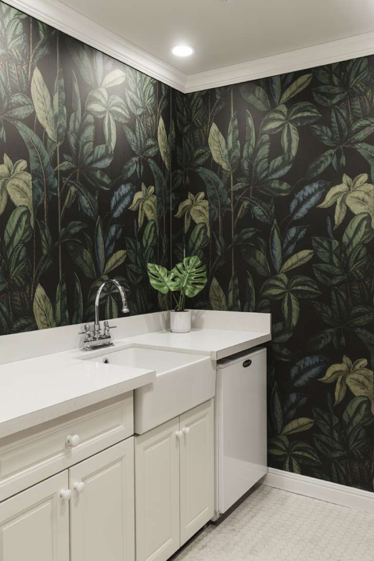 11 Beautiful Dark Laundry Room Ideas That Spark Instant Joy 8 Dark botanical wallpaper laundry room with white shaker cabinets and white hexagonal tile floor