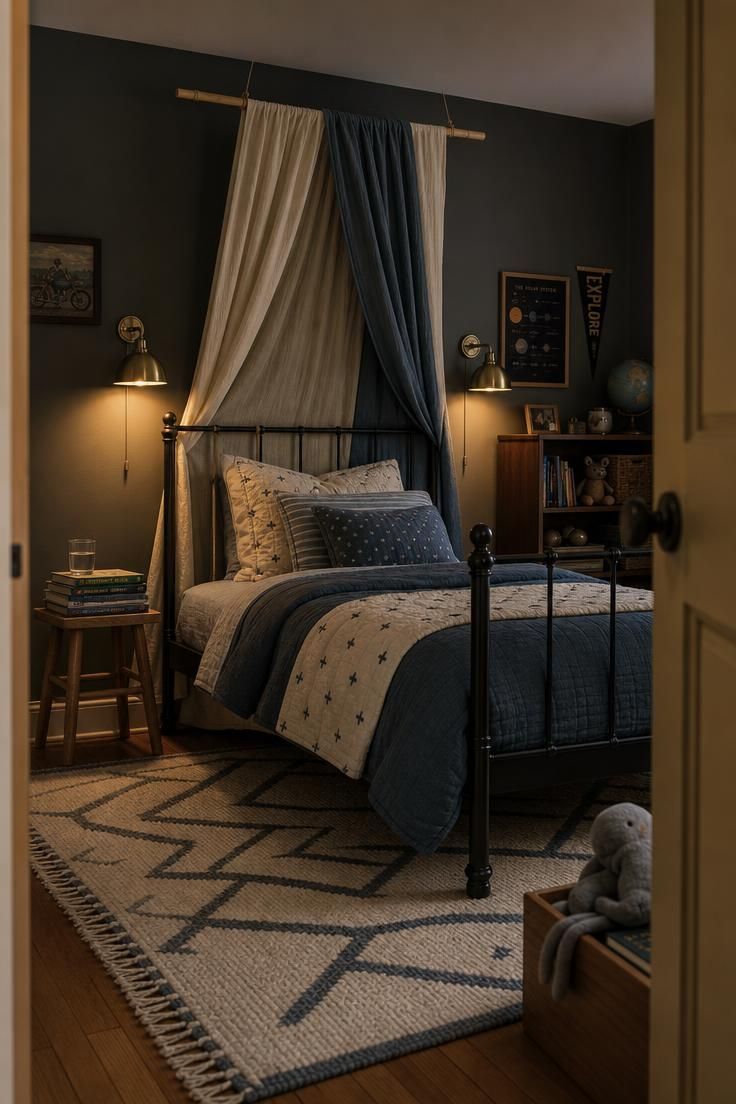 11 Joyful Eclectic Kids Room Ideas for Playful Souls 3 Black metal bed frame with layered cream and dusty blue canopy panels under glowing brass sconces in a moody eclectic kids room.
