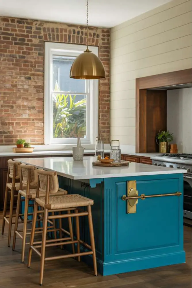 32 Eye-Catching Eclectic Kitchen Design Ideas to Love 12 Stylish eclectic kitchen with vibrant teal island, white quartz countertop, dark wood cabinetry, brass geometric hardware, and woven rattan bar stools