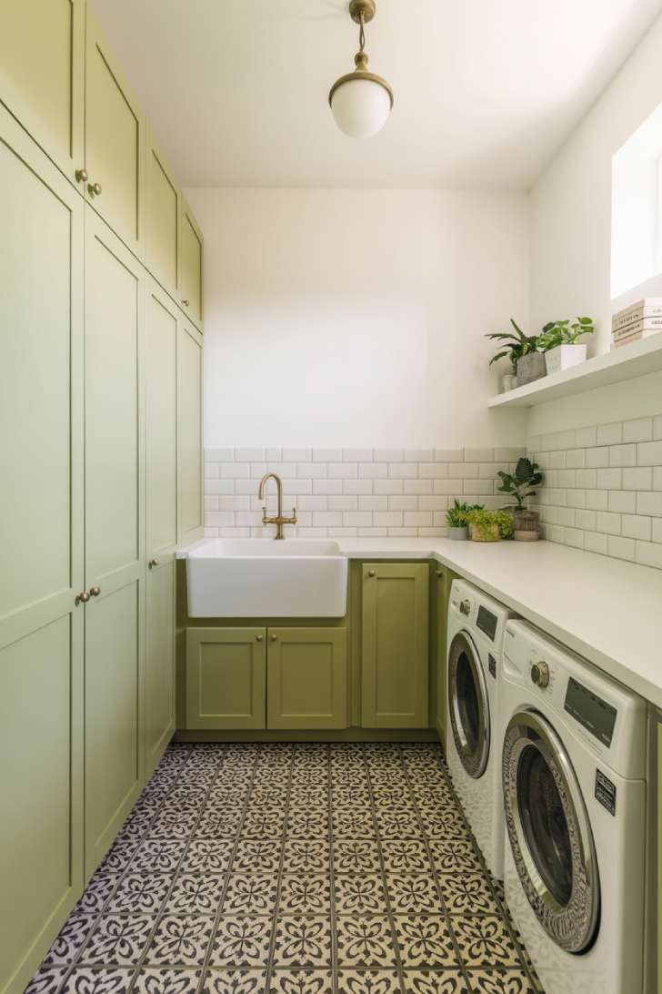 13 Brilliant Green Laundry Room Ideas for a Stylish Space 11 Sage green laundry room with black and white patterned encaustic tile floor and brass light fixture