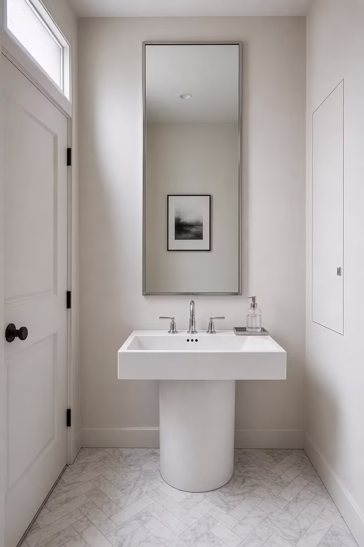 10 Half Bathroom Ideas With Pedestal Sink Worth Copying 10 Square basin pedestal sink with marble herringbone floor and polished chrome fixtures in a bright half bathroom