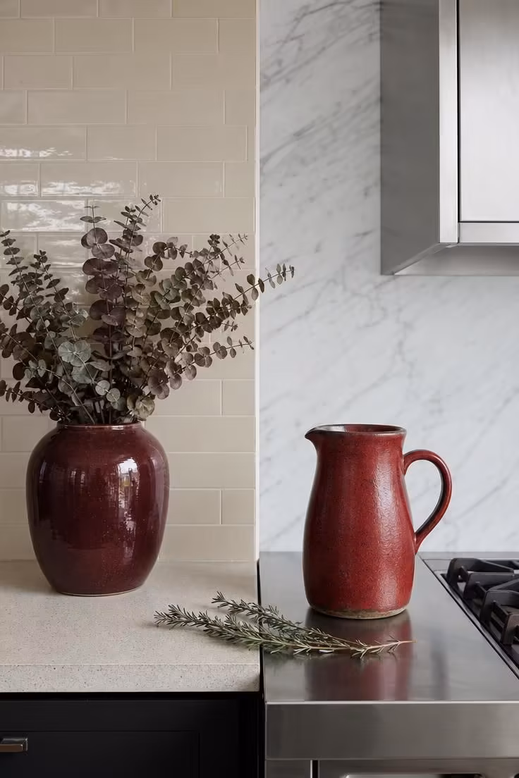 The One Color Shift That Makes a Kitchen With Red Accents Feel High-End 2 Side-by-side warm and cool red kitchen accents showing undertone differences against contrasting white backgrounds
