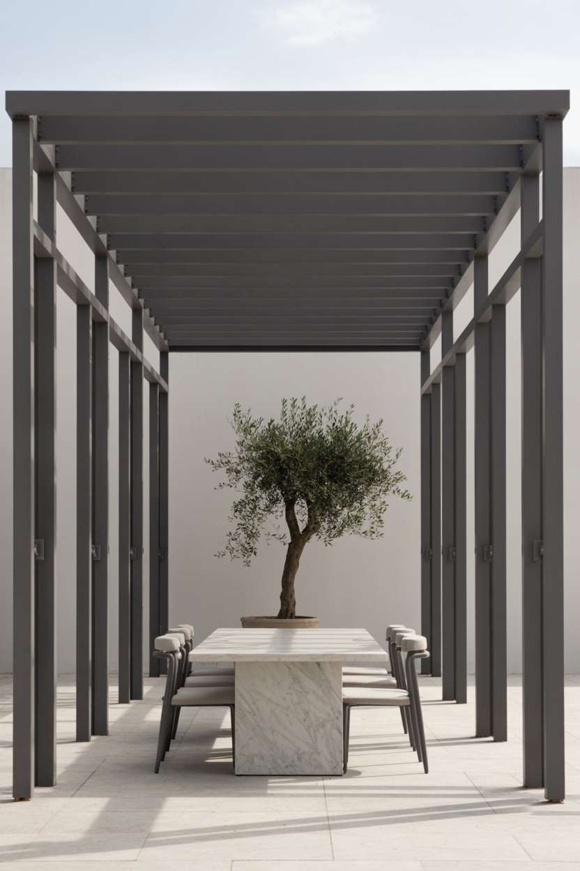 27 Stunning Modern Pergola Design Ideas for Stylish Shade 27 Minimalist dark grey steel pergola with flat roof over white marble table and modern chairs with olive tree accent