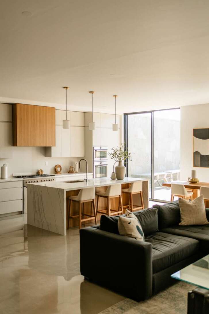 17 Inspiring Open Kitchen Design Ideas for Modern Living 3 Open kitchen and living room with minimalist fireplace and marble island