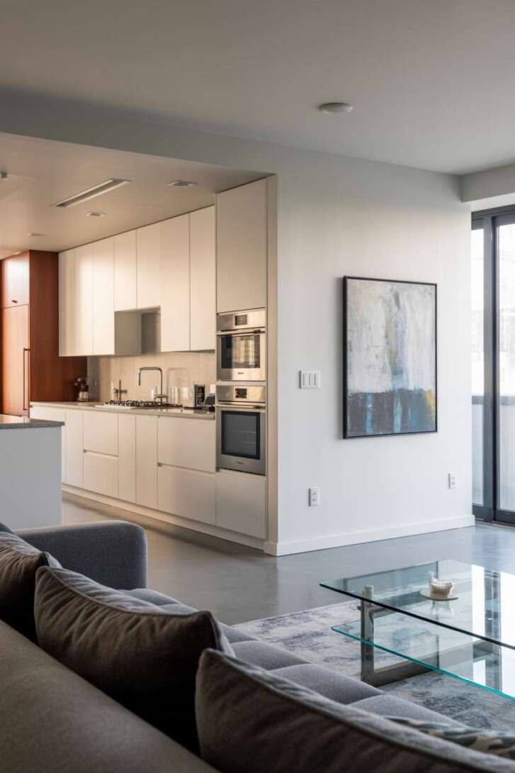 17 Inspiring Open Kitchen Design Ideas for Modern Living 10 Contemporary handleless kitchen flowing into living room space