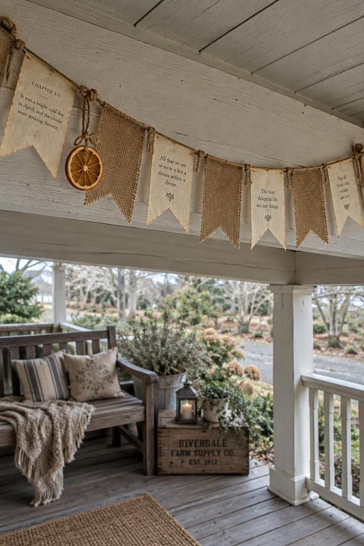 10 Rustic Halloween Decor Ideas for a Welcoming Porch 7 Overhead view of a burlap and cream book page banner swagged with jute twine over a painted porch beam, backlit by cool daylight.