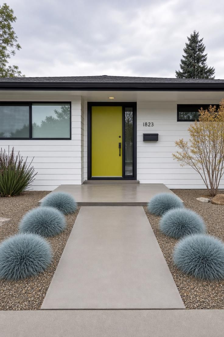17 Cozy Small Front Yard Landscaping Ideas You Will Love 14 Symmetrical rows of blue fescue mounds flanking a smooth concrete entry pad at a mid-century ranch home