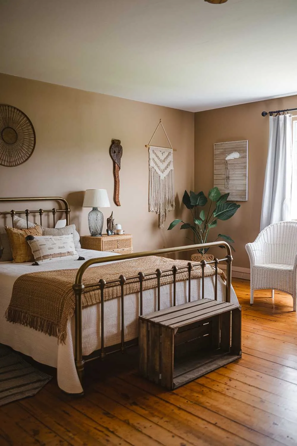 23 Vintage Farmhouse Bedroom Ideas for Cozy Charm 18 Stylish bedroom featuring brass bed, woven textiles, and wooden accents blending materials beautifully