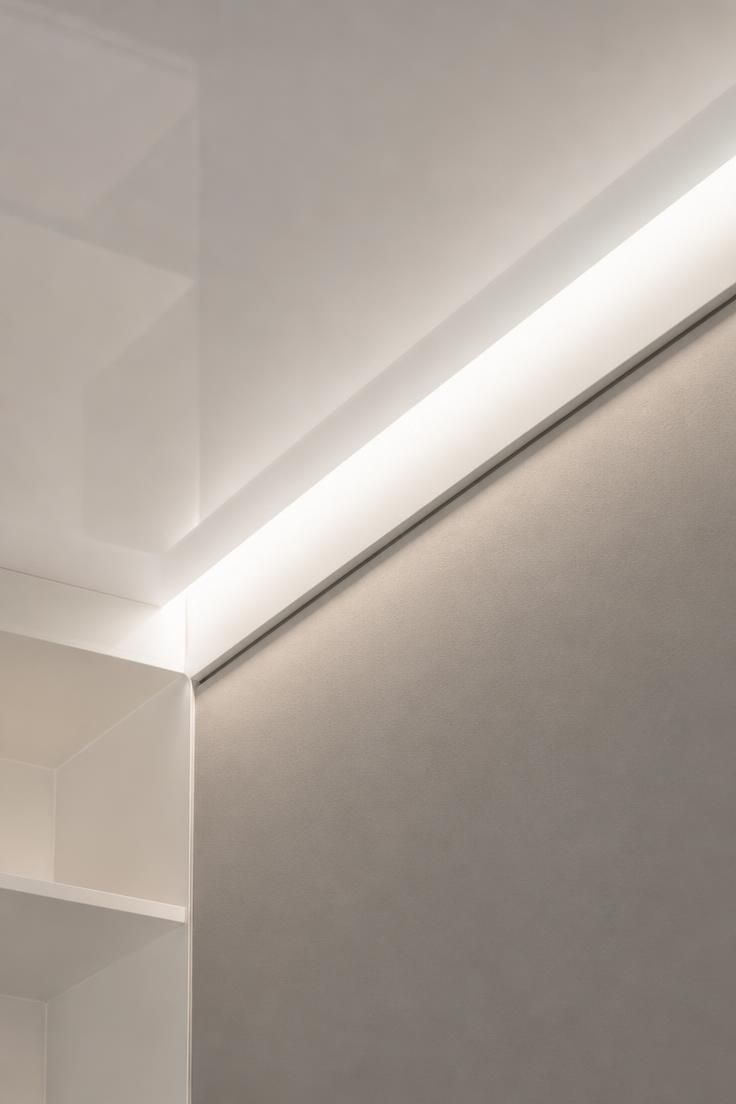 10 Clever Walk in Closet Ideas for Small Spaces Save Room 8 Small walk in closet lighting with a high-gloss ceiling and recessed cove lighting.